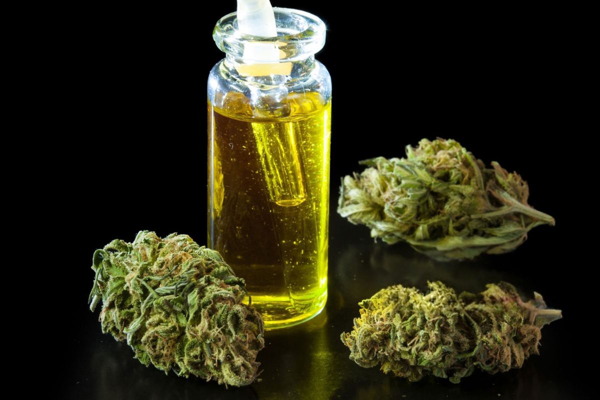 An image showing both cannabis tincture and flower