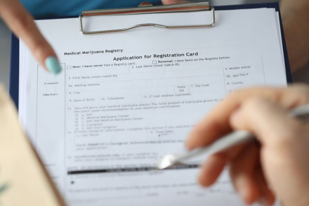 A person filling medical marijuana registration form