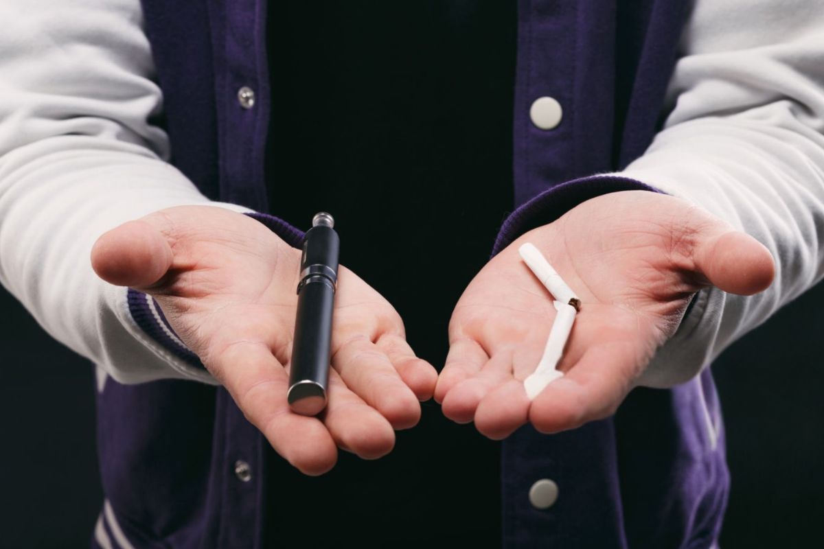 A person is quitting smoking with the help of a vape
