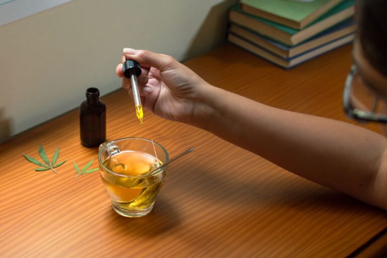 A person preparing cannabis-infused tea for THC microdosing