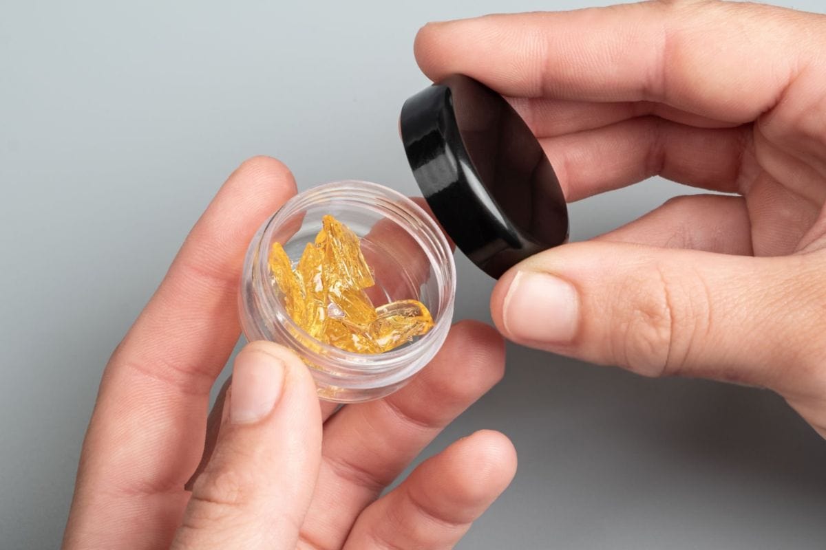 A person using cannabis live resin dab