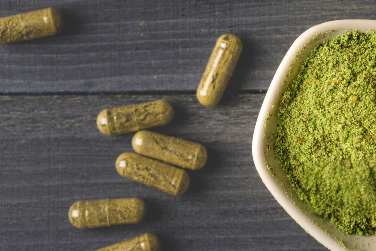 Different kratom tablets made from powder are placed together