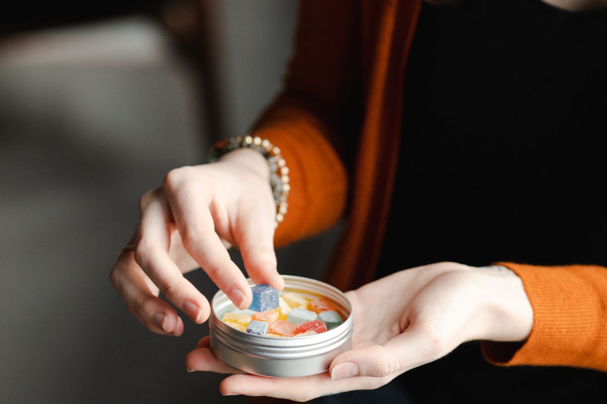 A lady eating cannabis gummies