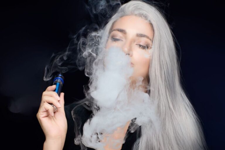 A lady is smoking a cart and experiencing a green-out effect